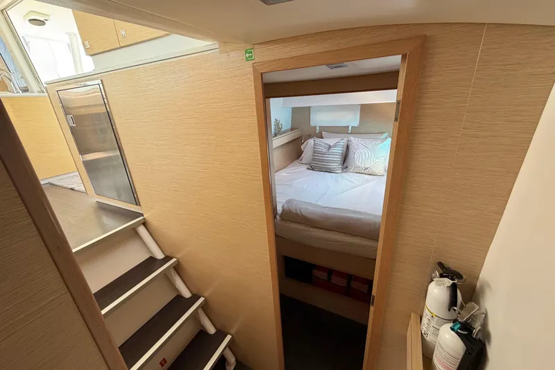Strategery X Yacht Photos Pics Interior of 2014 Outremer 45 catamaran, featuring cozy bedroom and modern design elements.