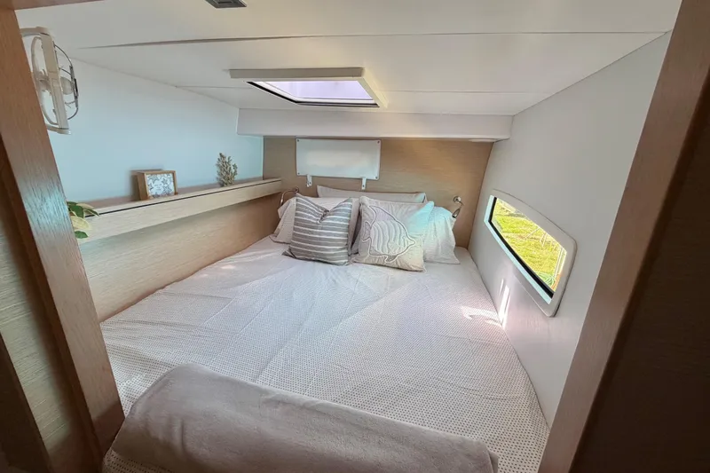 Strategery X Yacht Photos Pics Cozy bedroom interior of 2014 Outremer 45 yacht with skylight and side window.