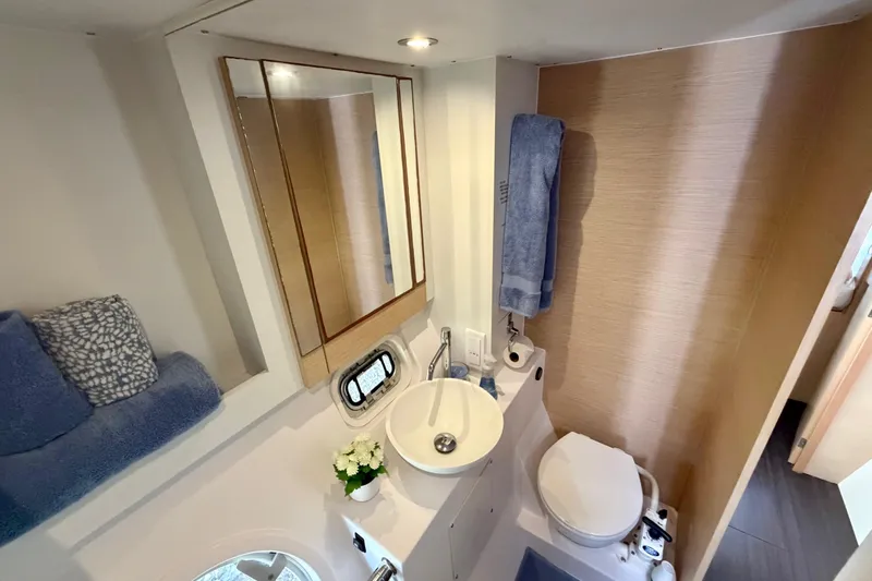 Strategery X Yacht Photos Pics Bathroom interior of 2014 Outremer 45 yacht, featuring sink, toilet, and mirror.
