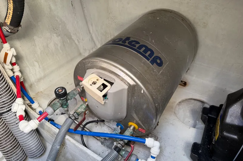 Strategery X Yacht Photos Pics Water heater system in a 2014 Outremer 45 yacht, featuring plumbing connections.