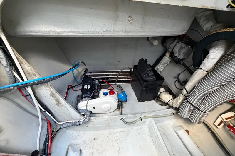 Strategery X Yacht Photos Pics Engine compartment of a 2014 Outremer 45 catamaran, showcasing mechanical components and wiring.