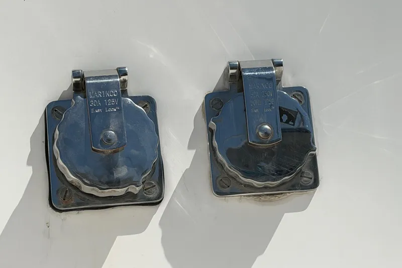 Strategery X Yacht Photos Pics Chrome electrical outlets on a 2014 Outremer 45 catamaran, labeled 30A 125V and 32A 250V.