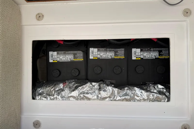 Strategery X Yacht Photos Pics Battery compartment of a 2014 Outremer 45 yacht, featuring three batteries and insulation.