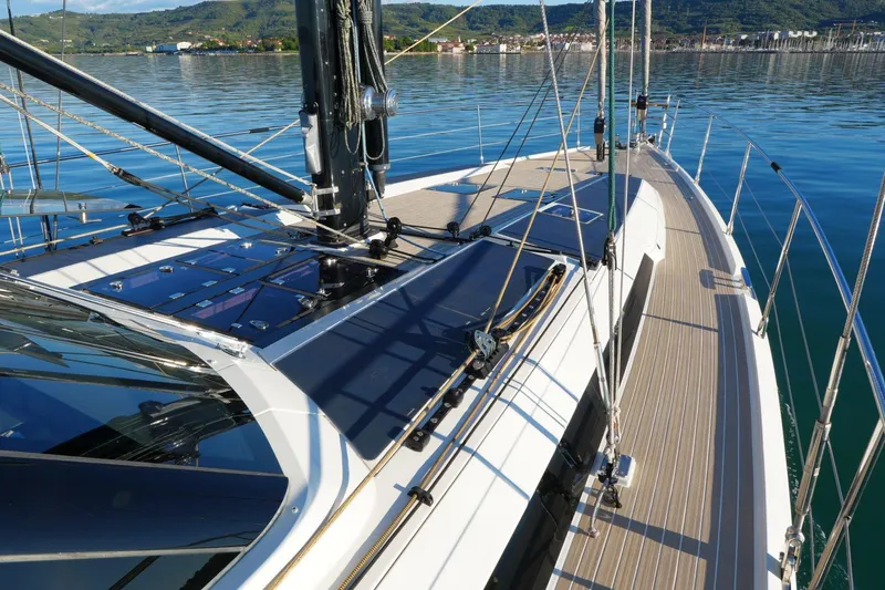  Yacht Photos Pics Sleek 2020 Amel 60 yacht deck with modern design and scenic water backdrop.