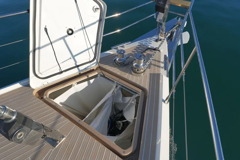  Yacht Photos Pics Open hatch on Amel 60 yacht deck, showcasing storage compartment and winches, 2020 model.