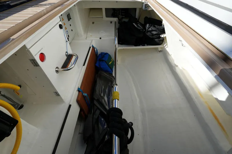  Yacht Photos Pics Storage compartment of a 2020 Amel 60 yacht, featuring organized equipment and safety gear.