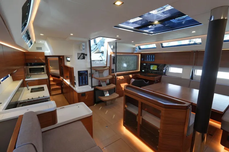  Yacht Photos Pics Luxurious interior of 2020 Amel 60 yacht with modern kitchen and dining area.