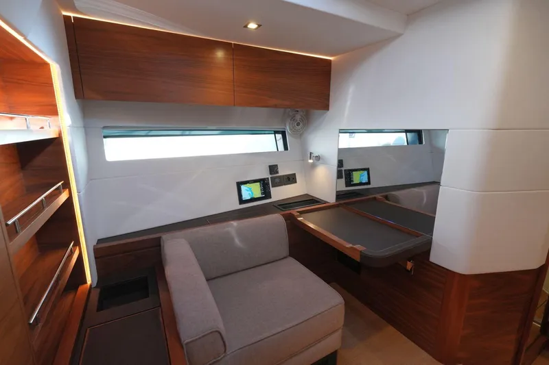  Yacht Photos Pics Luxurious interior of a 2020 Amel 60 yacht with modern wood finishes and seating.