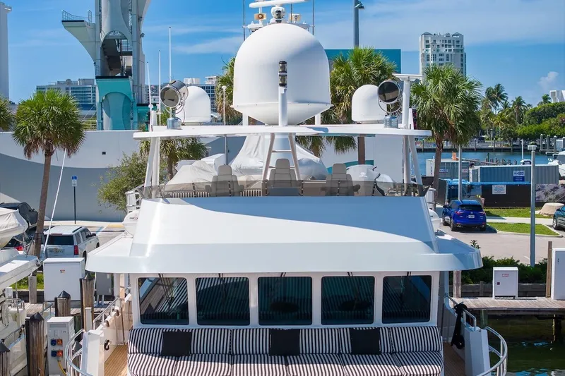  Yacht Photos Pics Luxury yacht ABD 90 Explorer, 1996 model, docked in a sunny marina setting.