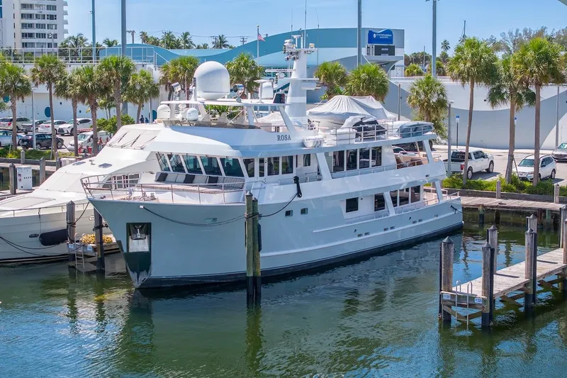  Yacht Photos Pics Luxury yacht ABD 90 Explorer 1996 docked at marina with palm trees.