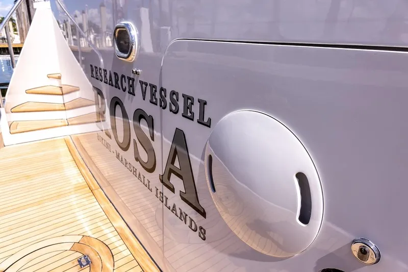  Yacht Photos Pics Research vessel "Rosa" docked, featuring wooden deck and sleek design, ABD 90 Explorer 1996.