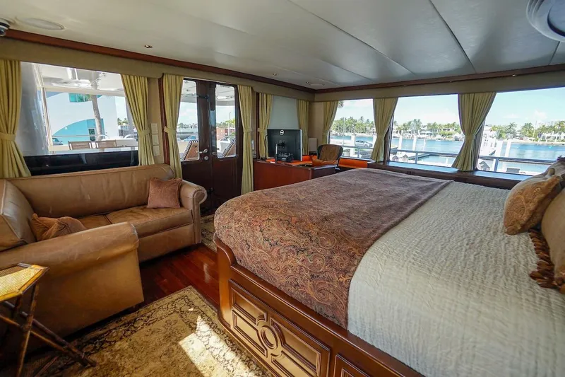  Yacht Photos Pics Luxurious 1996 ABD 90 Explorer yacht interior with elegant bedroom and scenic window views.