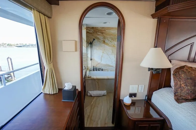  Yacht Photos Pics Luxurious 1996 ABD 90 Explorer yacht interior with elegant bedroom and marble bathroom.