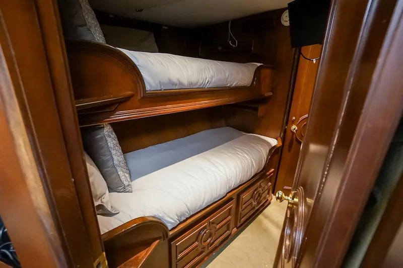  Yacht Photos Pics Bunk beds in a 1996 ABD 90 Explorer yacht cabin with wooden interior.