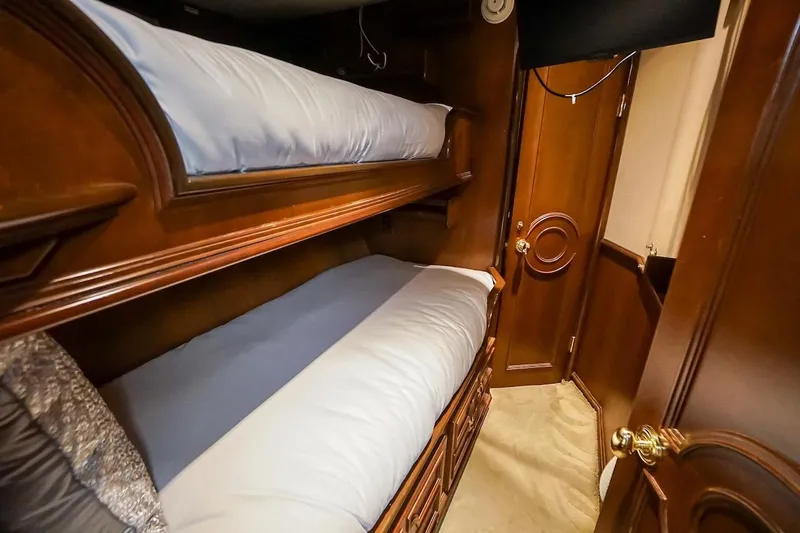  Yacht Photos Pics Luxurious wooden bunk beds in 1996 ABD 90 Explorer interior.