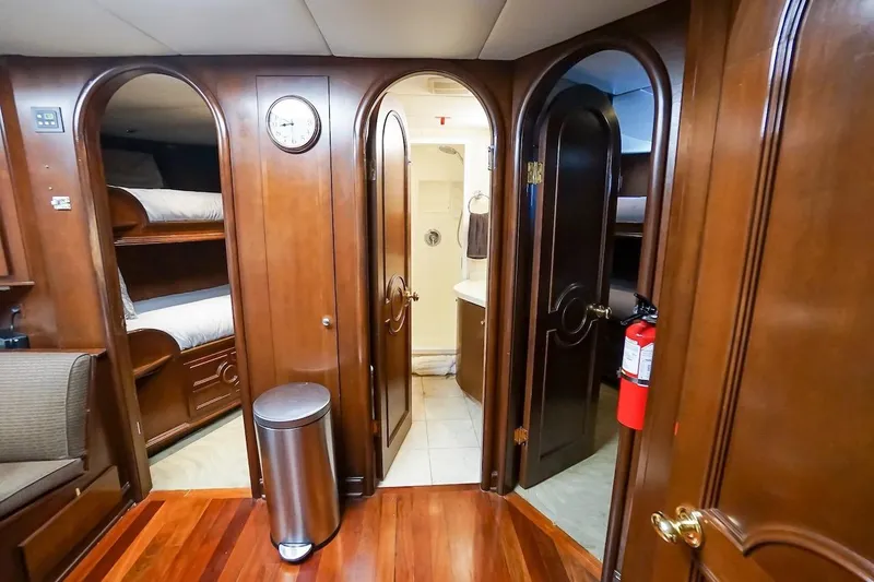  Yacht Photos Pics Luxurious wooden interior of 1996 ABD 90 Explorer yacht with bunk beds and bathroom.