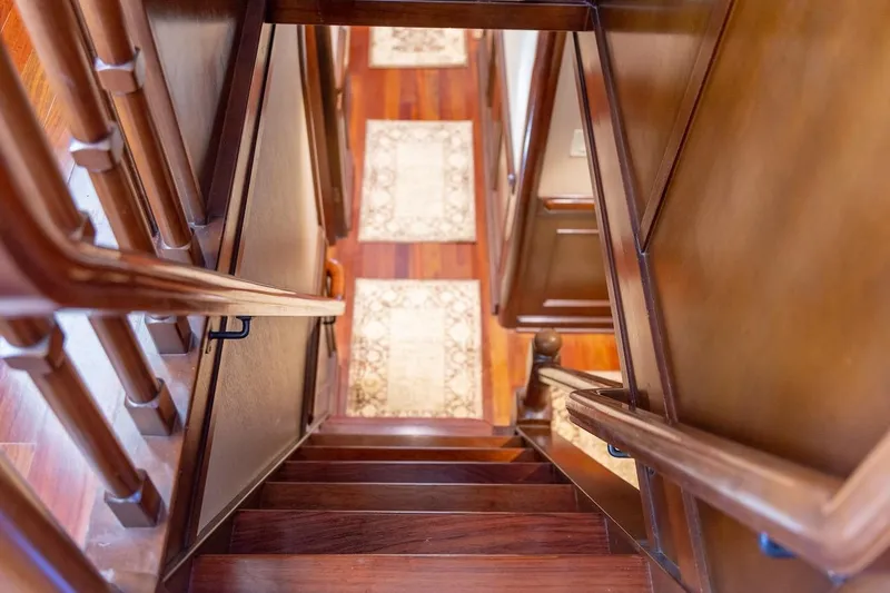  Yacht Photos Pics Wooden staircase with ornate railings inside a 1996 ABD 90 Explorer yacht.