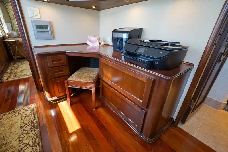 Yacht Photos Pics Luxurious wooden office space in 1996 ABD 90 Explorer yacht with printer and chair.