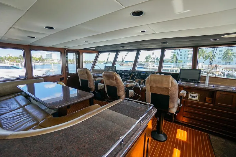  Yacht Photos Pics Luxurious interior of 1996 ABD 90 Explorer yacht with panoramic windows and plush seating.