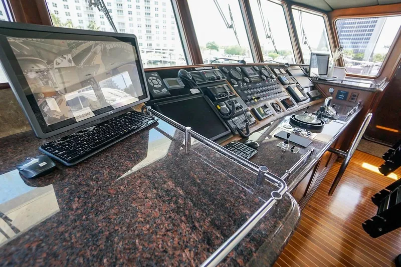  Yacht Photos Pics Control room of 1996 ABD 90 Explorer yacht with navigation equipment and monitors.