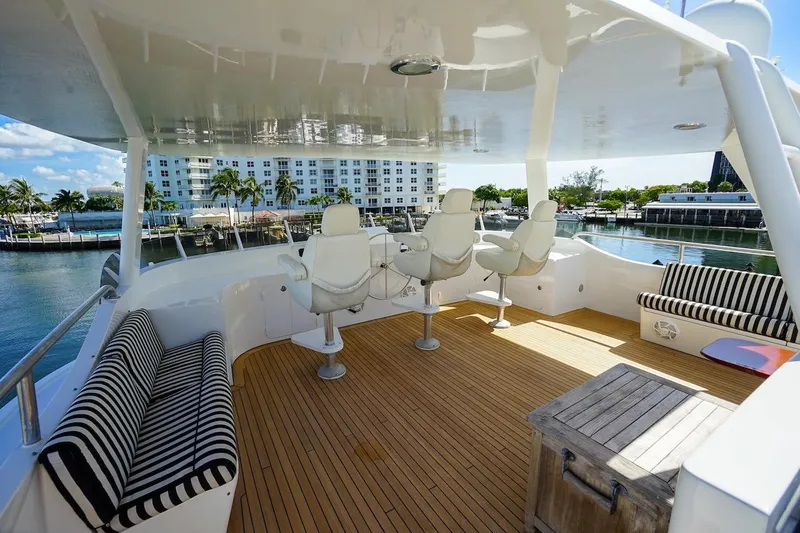  Yacht Photos Pics Luxurious 1996 ABD 90 Explorer yacht deck with seating and helm chairs.