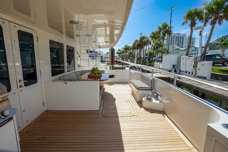  Yacht Photos Pics Luxurious 1996 ABD 90 Explorer yacht deck with seating and modern amenities.