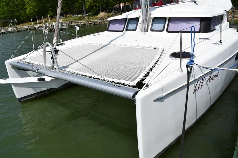 Lil Anna Yacht Photos Pics 2014 Fountaine Pajot Mahe 36 Evolution catamaran docked on calm water.