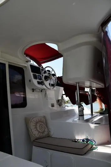 Lil Anna Yacht Photos Pics 2014 Fountaine Pajot Mahe 36 Evolution yacht interior with helm and seating area.