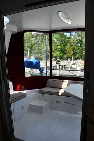 Lil Anna Yacht Photos Pics Interior view of 2014 Fountaine Pajot Mahe 36 Evolution catamaran with seating and outdoor scenery.