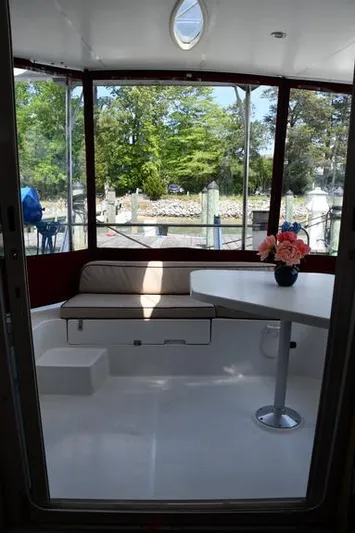 Lil Anna Yacht Photos Pics Interior view of 2014 Fountaine Pajot Mahe 36 Evolution catamaran with seating and table.