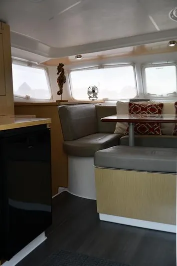 Lil Anna Yacht Photos Pics Interior of 2014 Fountaine Pajot Mahe 36 Evolution catamaran, featuring cozy seating and modern decor.