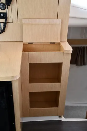 Lil Anna Yacht Photos Pics Interior storage shelves on 2014 Fountaine Pajot Mahe 36 Evolution catamaran.