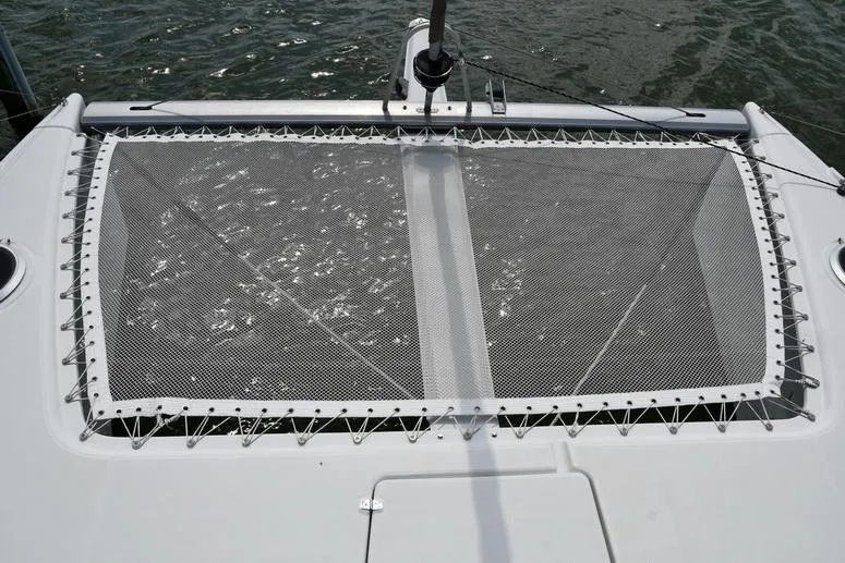Lil Anna Yacht Photos Pics 2014 Fountaine Pajot Mahe 36 Evolution catamaran trampoline netting over water.