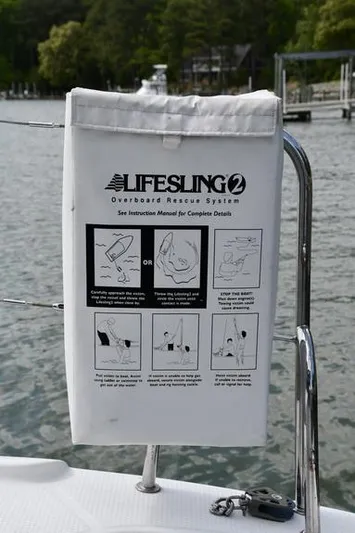 Lil Anna Yacht Photos Pics Lifesling 2 rescue system on 2014 Fountaine Pajot Mahe 36 Evolution catamaran, docked by water.