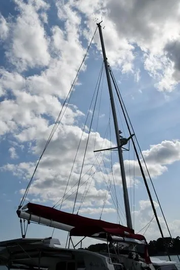 Lil Anna Yacht Photos Pics Sailboat mast of 2014 Fountaine Pajot Mahe 36 Evolution against cloudy sky.