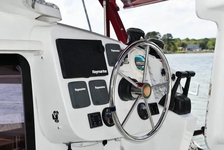 Lil Anna Yacht Photos Pics Steering wheel and controls of 2014 Fountaine Pajot Mahe 36 Evolution catamaran.