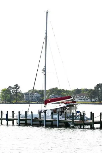 Lil Anna Yacht Photos Pics 2014 Fountaine Pajot Mahe 36 Evolution catamaran docked by waterfront homes.