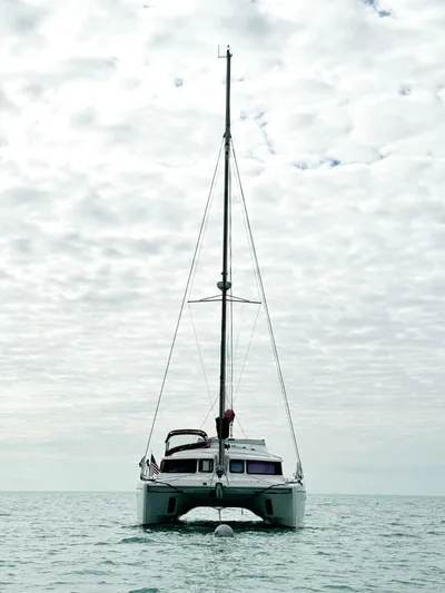 Lil Anna Yacht Photos Pics 2014 Fountaine Pajot Mahe 36 Evolution catamaran on calm sea under cloudy sky.