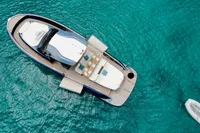 2022 Solaris Power 44 Open yacht on clear turquoise water, aerial view.