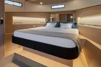 Luxurious interior of 2022 Solaris Power 44 Open yacht with modern bedroom design.