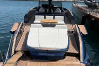 2022 Solaris Power 44 Open yacht with sleek design and spacious deck in a marina.