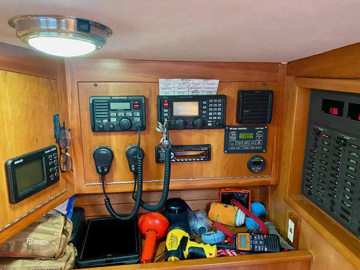 Navicula Yacht Photos Pics Navigation equipment and tools inside a 2001 J Boats J/46 yacht cabin.