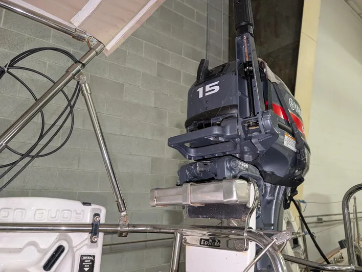 Navicula Yacht Photos Pics Outboard motor on a 2001 J Boats J/46 sailboat, mounted on a metal frame.