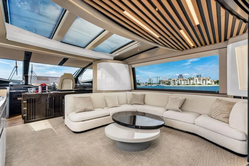 Latitude Yacht Photos Pics Luxurious interior of 2022 Azimut S10 yacht with panoramic windows and elegant seating.