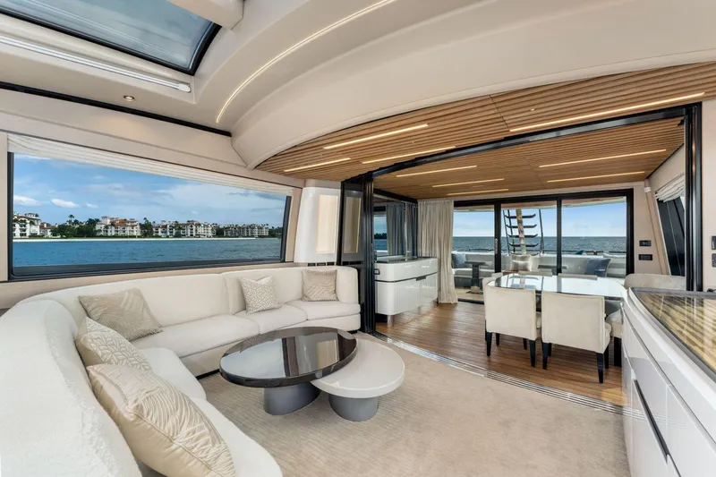 Latitude Yacht Photos Pics Luxurious interior of 2022 Azimut S10 yacht with elegant seating and ocean view.