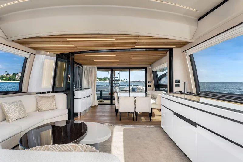 Latitude Yacht Photos Pics Luxurious interior of 2022 Azimut S10 yacht with ocean view and elegant furnishings.