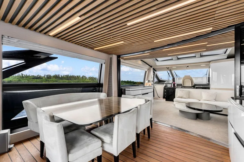 Latitude Yacht Photos Pics Luxurious interior of 2022 Azimut S10 yacht with elegant dining and seating areas.