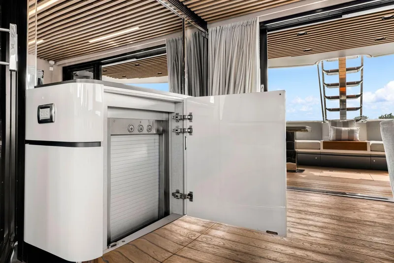 Latitude Yacht Photos Pics Luxurious interior of 2022 Azimut S10 yacht with open cabinet and modern design.