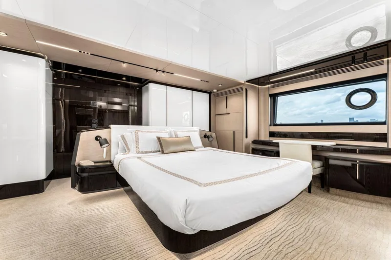 Latitude Yacht Photos Pics Luxurious bedroom interior of 2022 Azimut S10 yacht with modern design and large window view.