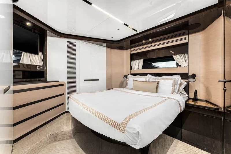 Latitude Yacht Photos Pics Luxurious bedroom interior of 2022 Azimut S10 yacht, featuring elegant design and modern amenities.